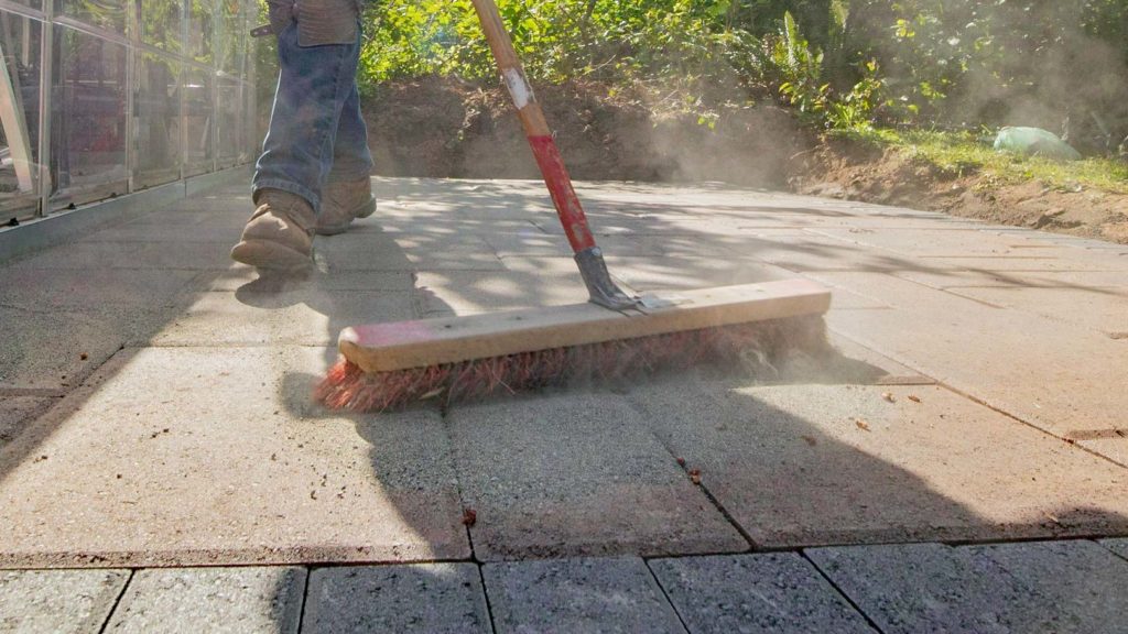 Sweep polymeric or concrete sand