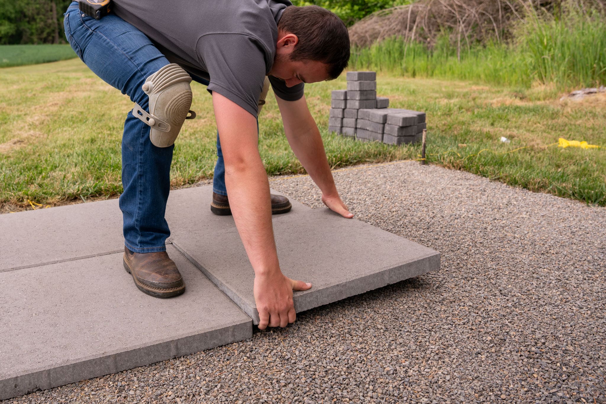 Laying on sale concrete pavers