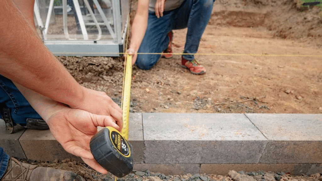 Measuring a straight and level reference line for a paver project